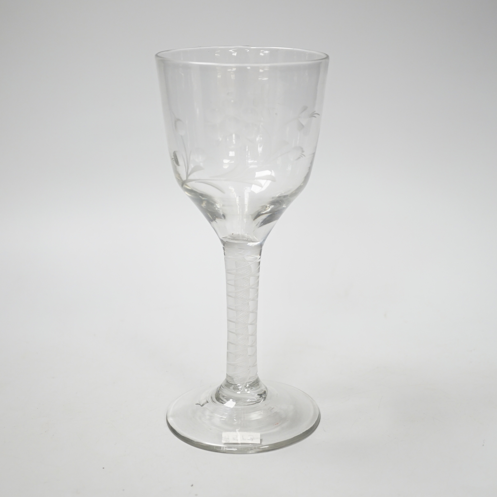 An English lead crystal DSOT goblet, c.1760, ogee bowl with tool marks and engraved with polished flora opposite a single insect which appears to be a bee, two spiral tapes around a gauze, conical foot, broken pontil, 18